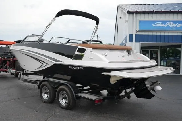 Slide: The Image of 2017 Glastron GT 245 boat on trailer outside dealership. - 7