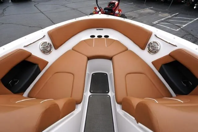 Slide: The Image of 2017 Glastron GT 245 boat interior with tan seating and modern design. - 9