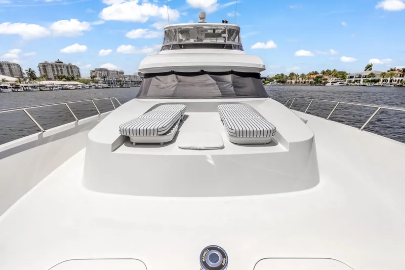 Slide: The Image of Luxury 2009 Cheoy Lee 78 yacht with sunbathing area, cruising on a scenic waterway. - 11