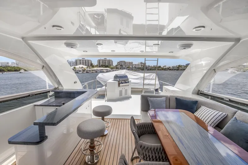 Slide: The Image of Luxurious 2009 Cheoy Lee 78 yacht interior with elegant seating and waterfront view. - 16