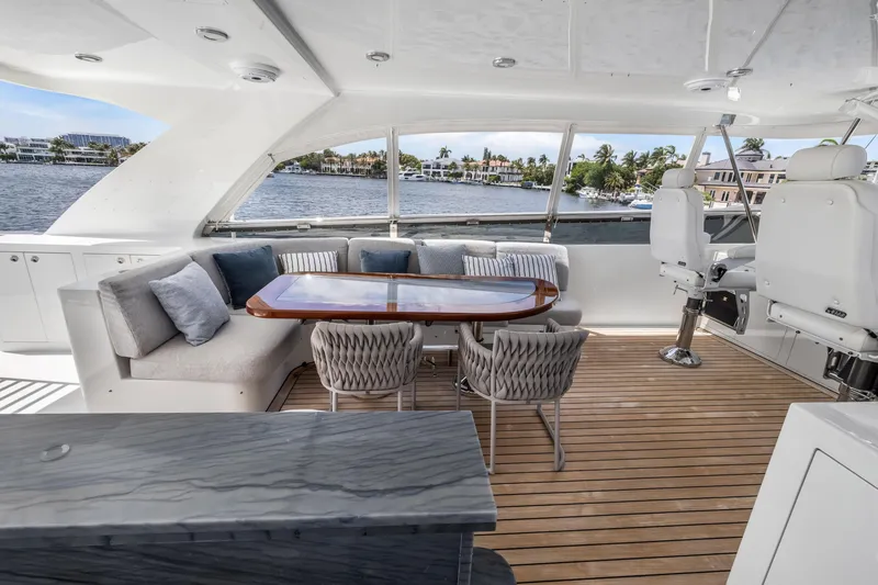 Slide: The Image of Luxurious 2009 Cheoy Lee 78 yacht interior with elegant seating and scenic water views. - 18