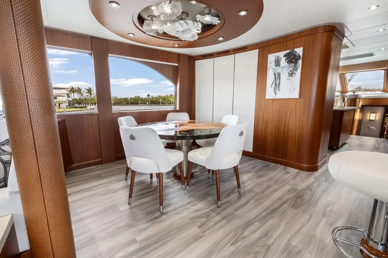 Slide: The Image of Luxurious dining area on a 2009 Cheoy Lee 78 yacht with elegant wood finishes. - 30