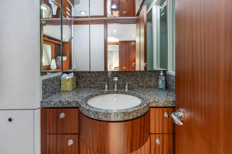 Slide: The Image of Luxurious 2009 Cheoy Lee 78 yacht helm with modern controls and elegant wood finish. - 33