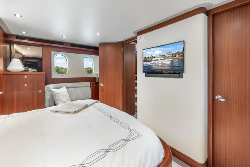 Slide: The Image of Luxurious 2009 Cheoy Lee 78 yacht interior with elegant wood finishes and modern amenities. - 35