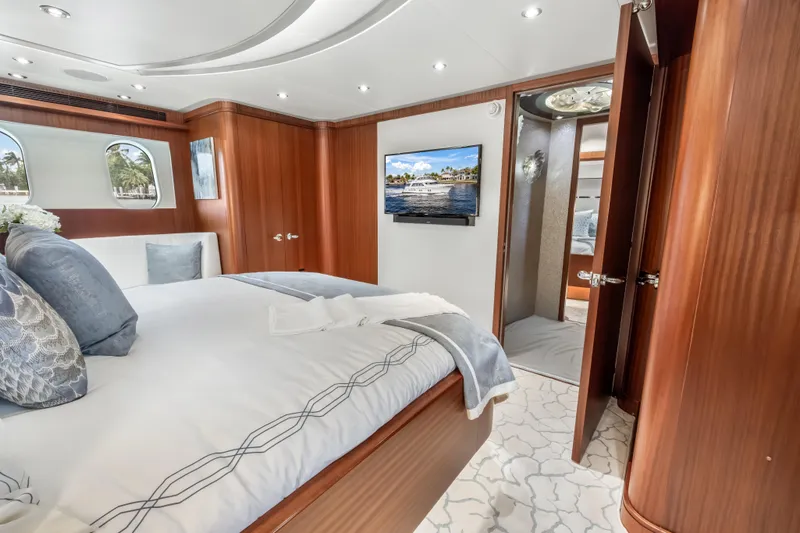 Slide: The Image of Luxurious 2009 Cheoy Lee 78 yacht bedroom with elegant wood finishes and modern amenities. - 38