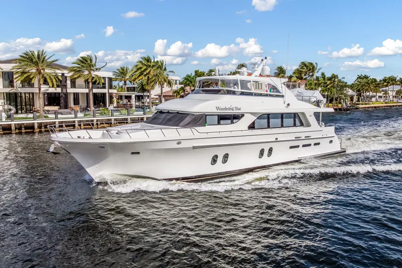 Slide: The Image of Luxury 2009 Cheoy Lee 78 yacht cruising on a sunny day with palm trees in the background. - 4
