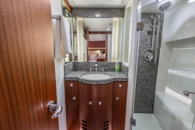 Slide: The Image of Luxurious Cheoy Lee 78 yacht bathroom with elegant wood cabinetry and modern glass sink, 2009 model. - 42