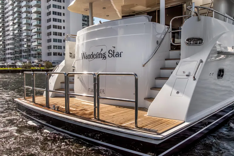 Slide: The Image of Luxury yacht "Wandering Star" docked, Cheoy Lee 78 model, 2009, in urban marina setting. - 8
