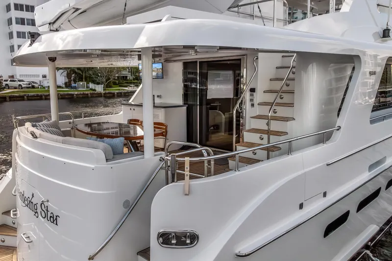 Slide: The Image of Luxurious 2009 Cheoy Lee 78 yacht with elegant outdoor seating and sleek design. - 9