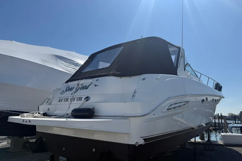 Slide: The Image of Sea Ray Sundancer 460 yacht, 2000 model, docked under clear blue sky. - 2
