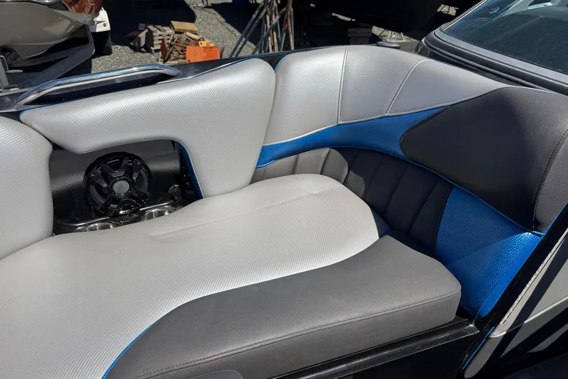 Slide: The Image of 2015 TomCat MB Sports Wake 22 boat interior with gray and blue seating. - 17
