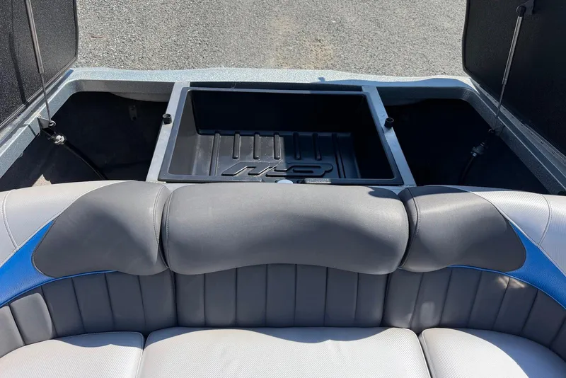 Slide: The Image of 2015 TomCat MB Sports Wake 22 boat interior with open storage compartment. - 19