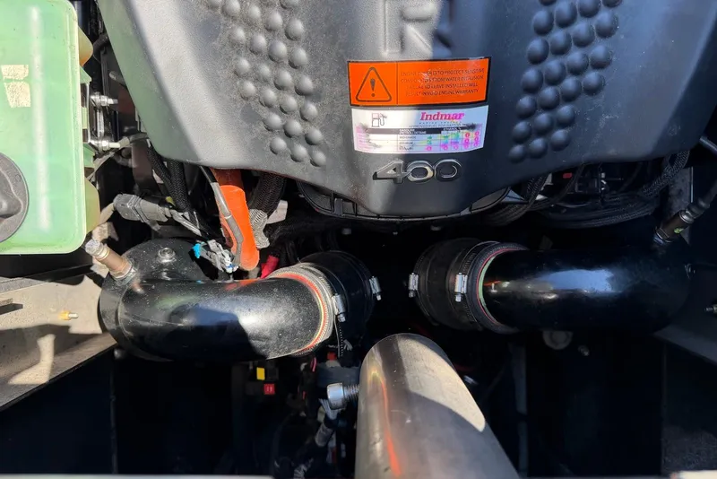 Slide: The Image of Engine compartment of a 2015 TomCat MB Sports Wake 22 boat. - 23