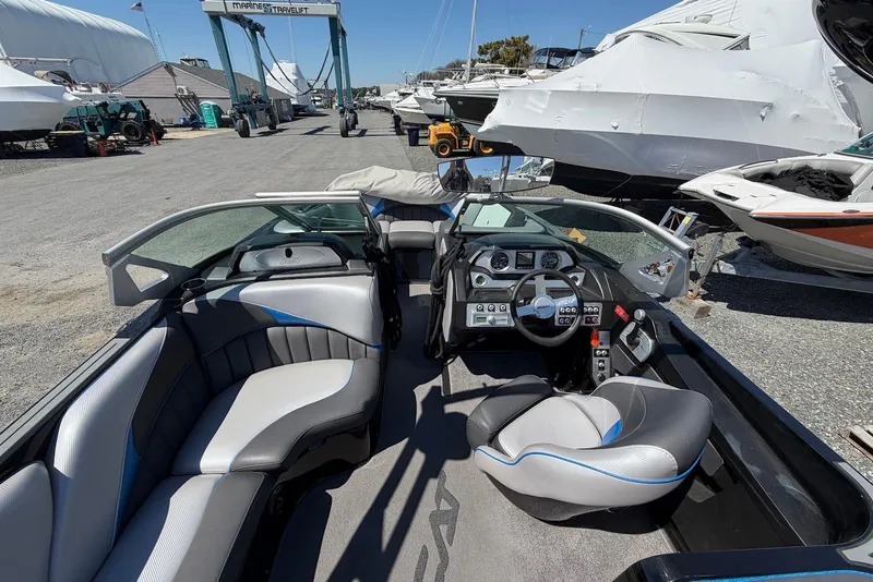 Slide: The Image of Interior of a 2015 TomCat MB Sports Wake 22 boat at a marina. - 6