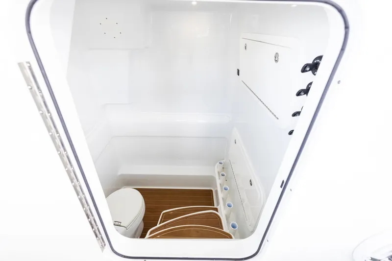 Slide: The Image of 2023 Yellowfin 39 Offshore boat interior with toilet and storage compartments. - 51