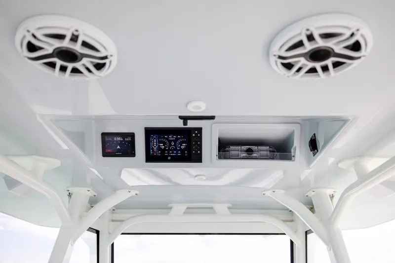 Slide: The Image of 2023 Yellowfin 39 Offshore boat dashboard with speakers and electronic displays. - 27