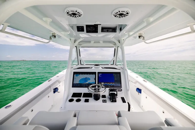 Slide: The Image of 2023 Yellowfin 39 Offshore boat dashboard with ocean view. - 25