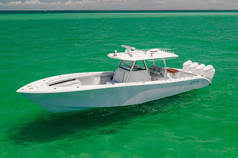 Slide: The Image of 2023 Yellowfin 39 Offshore boat on vibrant turquoise water. - 3