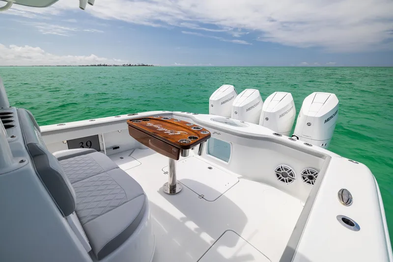 Slide: The Image of 2023 Yellowfin 39 Offshore boat with quad Mercury engines on turquoise water. - 37