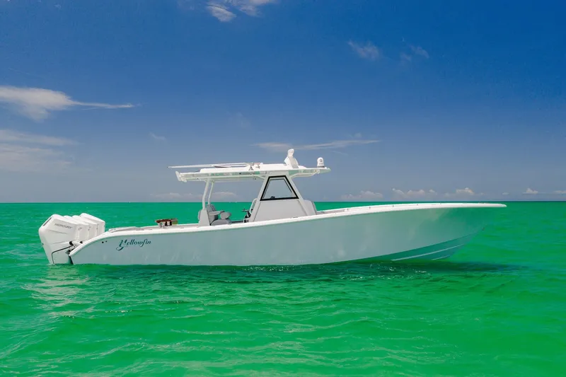 The Image of 2023 Yellowfin 39 Offshore boat on turquoise water under clear blue sky. - 1