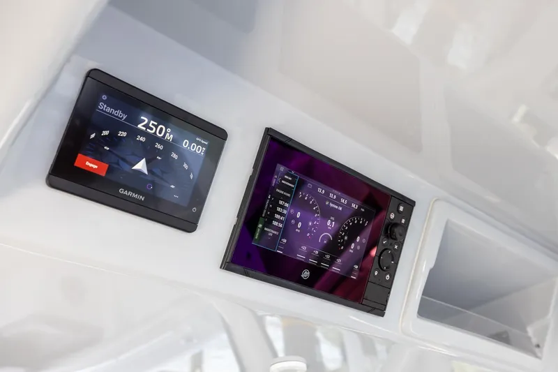 Slide: The Image of Garmin navigation displays on 2023 Yellowfin 39 Offshore boat dashboard. - 52