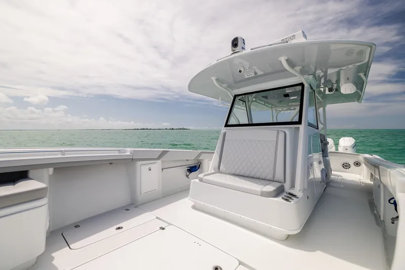Slide: The Image of 2023 Yellowfin 39 Offshore boat on open water under a cloudy sky. - 15