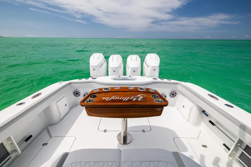 Slide: The Image of 2023 Yellowfin 39 Offshore boat with four engines on turquoise water. - 39