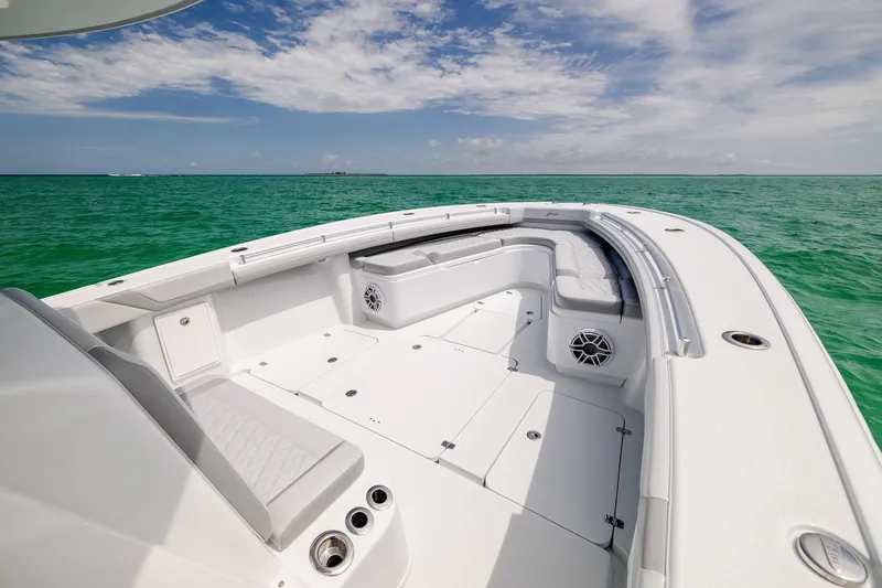 Slide: The Image of 2023 Yellowfin 39 Offshore boat on turquoise ocean under blue sky. - 11