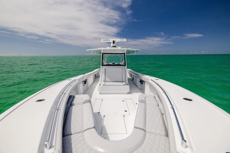 Slide: The Image of 2023 Yellowfin 39 Offshore boat on turquoise ocean under clear blue sky. - 14