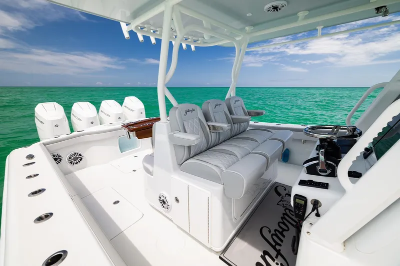 Slide: The Image of 2023 Yellowfin 39 Offshore boat interior with luxurious seating and multiple outboard engines. - 20