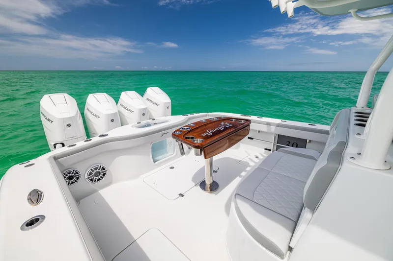 Slide: The Image of 2023 Yellowfin 39 Offshore boat with quad Mercury engines on turquoise water. - 38
