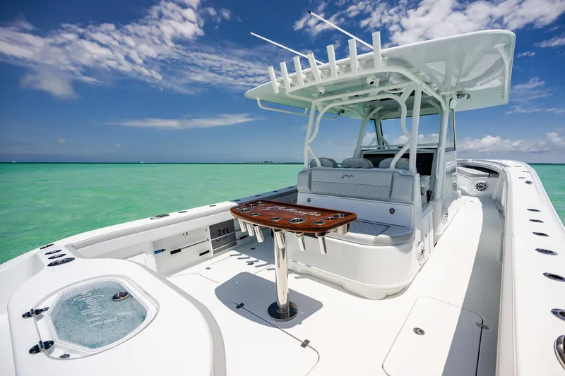 Slide: The Image of 2023 Yellowfin 39 Offshore boat on turquoise water under blue sky. - 30
