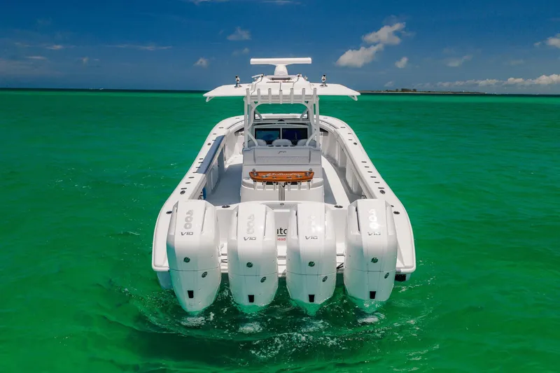 Slide: The Image of 2023 Yellowfin 39 Offshore boat with four engines on turquoise water. - 5