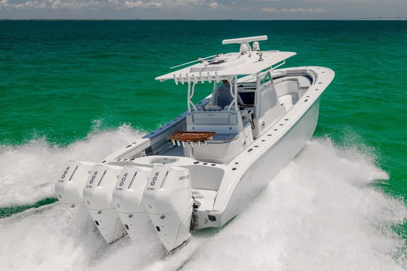 Slide: The Image of 2023 Yellowfin 39 Offshore boat cruising on turquoise ocean waters. - 7