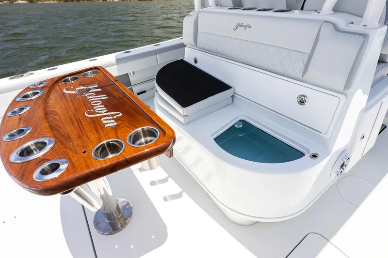 Slide: The Image of 2023 Yellowfin 39 Offshore boat interior with custom wood table and seating. - 34