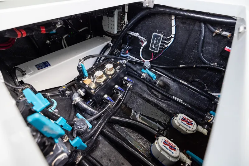 Slide: The Image of Engine compartment of 2023 Yellowfin 39 Offshore boat, showcasing intricate wiring and components. - 48