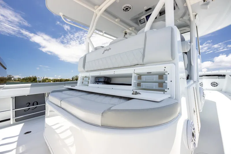 Slide: The Image of 2023 Yellowfin 39 Offshore boat interior with cushioned seating and storage compartments. - 33