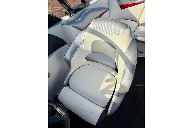 Slide: The Image of 2012 Tigé R20 boat seat with white and gray upholstery, featuring ergonomic design. - 11