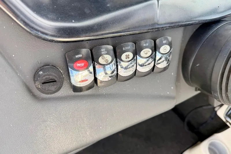 Slide: The Image of Control panel of a 2012 Tigé R20 boat with labeled switches for horn, navigation, and accessories. - 18