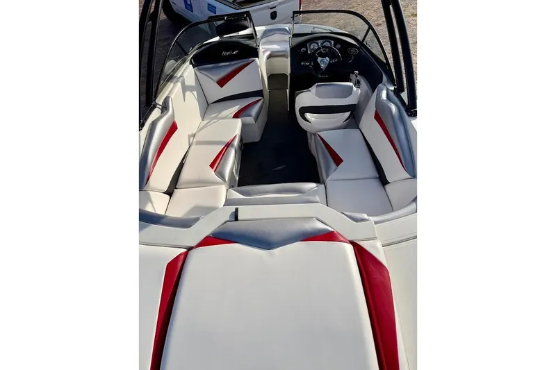 Slide: The Image of 2012 Tigé R20 boat interior with white and red seating, sleek design. - 5