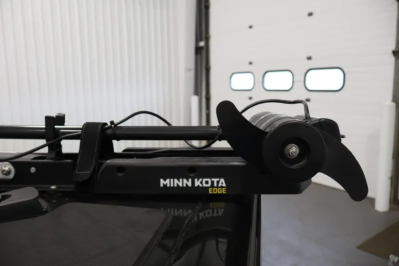 Slide: The Image of Minn Kota Edge trolling motor on 2022 Tracker Pro Team 175 TXW boat in garage. - 13