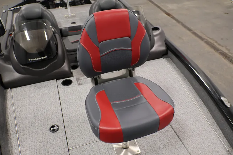 Slide: The Image of 2022 Tracker Pro Team 175 TXW boat seat, red and gray design, on deck. - 17