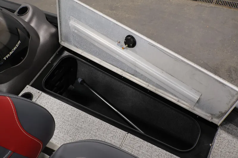 Slide: The Image of 2022 Tracker Pro Team 175 TXW boat storage compartment with open lid. - 18