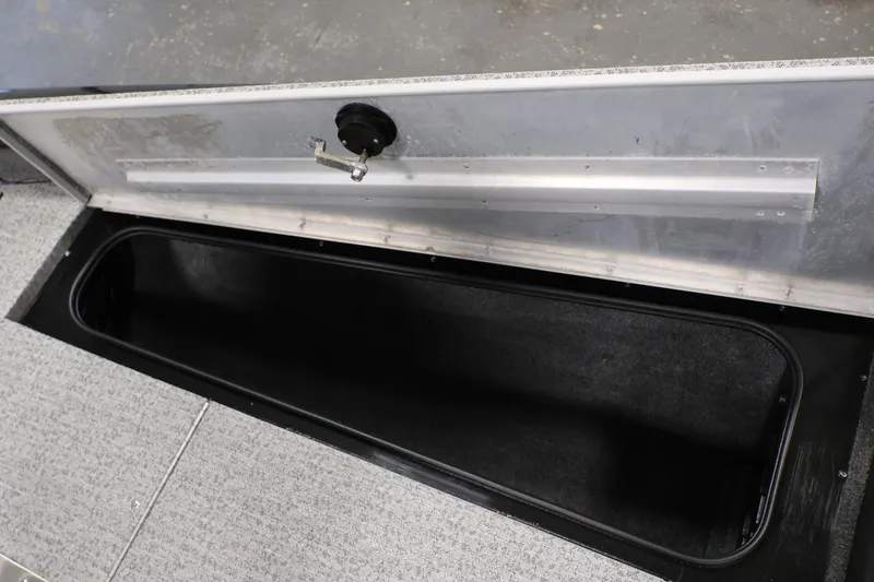 Slide: The Image of 2022 Tracker Pro Team 175 TXW storage compartment with open lid, showcasing interior space. - 20