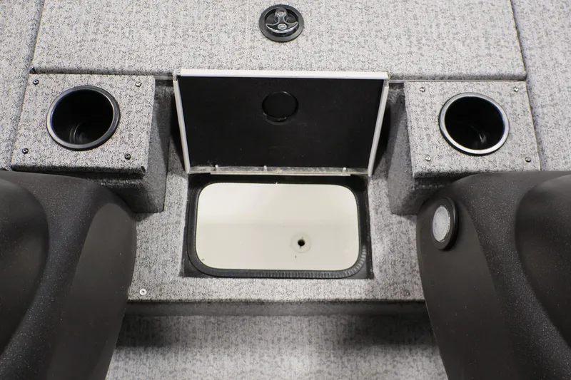 Slide: The Image of 2022 Tracker Pro Team 175 TXW boat interior with cup holders and storage compartment. - 21