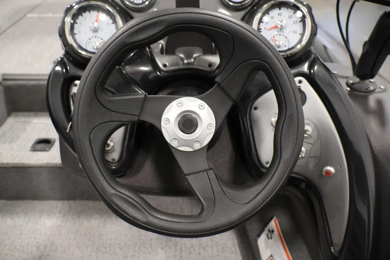 Slide: The Image of Steering wheel and dashboard of 2022 Tracker Pro Team 175 TXW boat. - 24