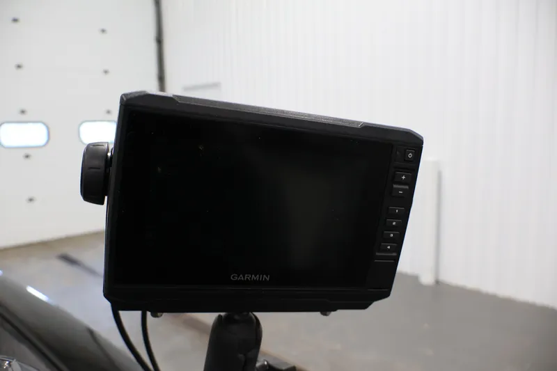 Slide: The Image of Garmin device on 2022 Tracker Pro Team 175 TXW boat in a garage setting. - 27