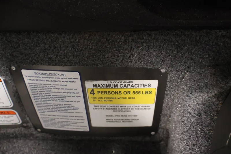 Slide: The Image of Capacity label on 2022 Tracker Pro Team 175 TXW boat, showing limits and safety checklist. - 30