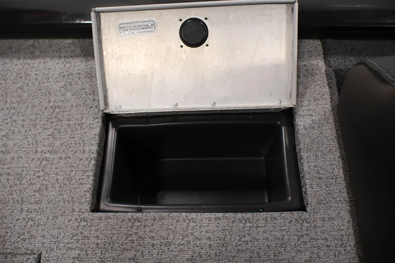 Slide: The Image of Open storage compartment in 2022 Tracker Pro Team 175 TXW boat. - 37