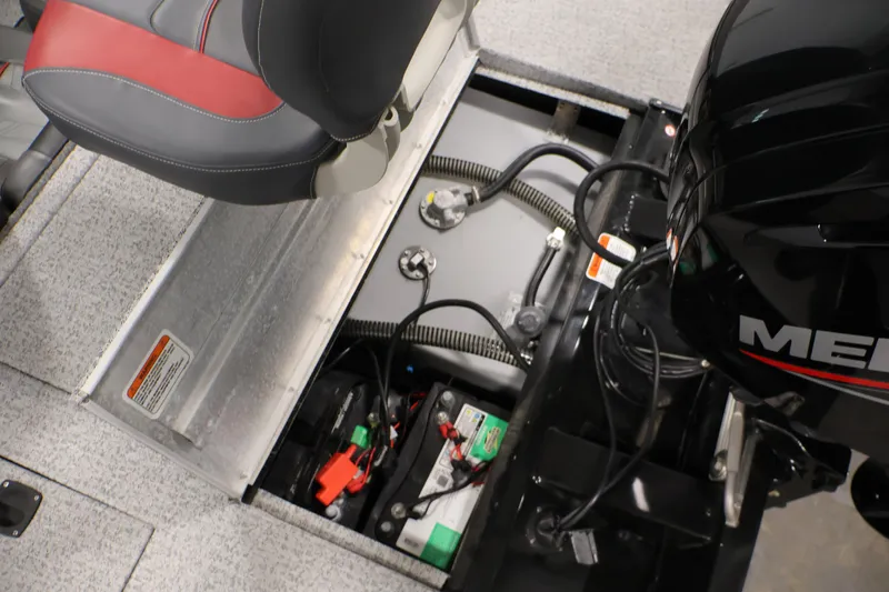 Slide: The Image of 2022 Tracker Pro Team 175 TXW boat interior showing engine and battery compartment. - 40